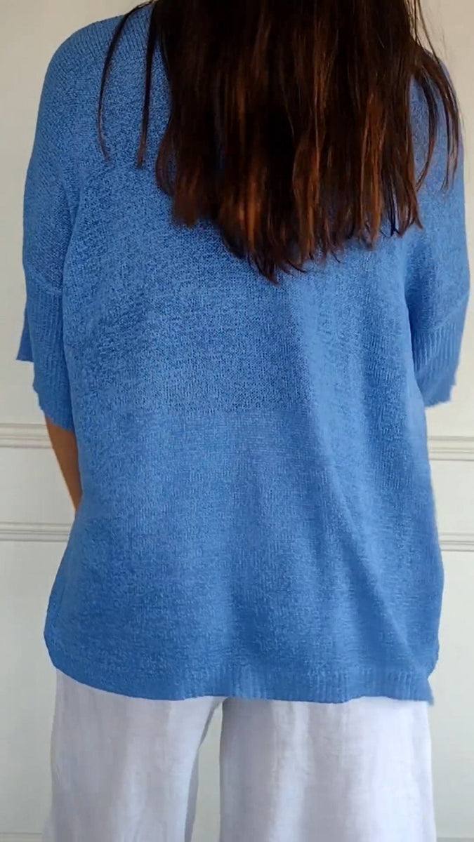 Solid 3/4 sleeve knit top featuring open V-neck collar main image 1